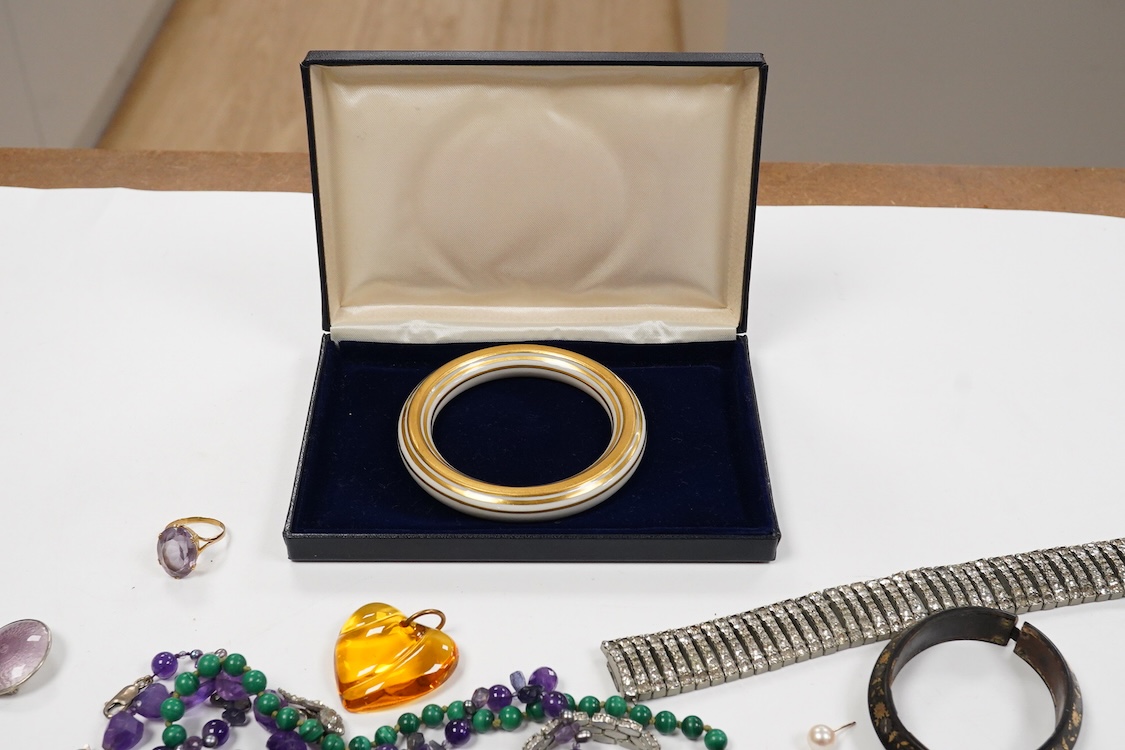 A 9ct and cabochon black onyx set pendant, on a 9ct chain, a 9ct and gem set ring and pair of 9ct and cultured pearl set ear clips, together with other items including costume jewellery, a silver bangle and a silver book